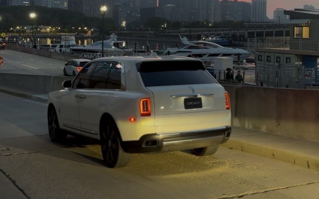 White Rolls-Royce Cullinan wedding car rental in Chicago at dusk